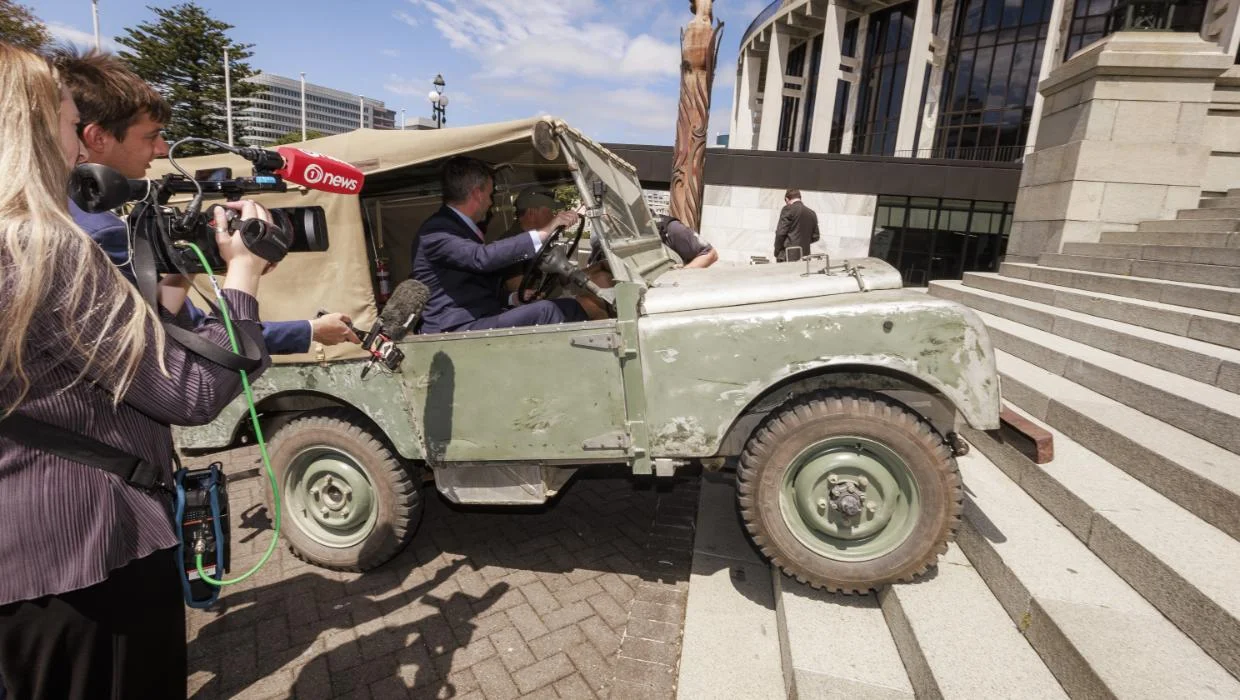 ACT Leader David Seymour drives landrover up parliament steps